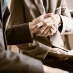 lawyer and client shake hands