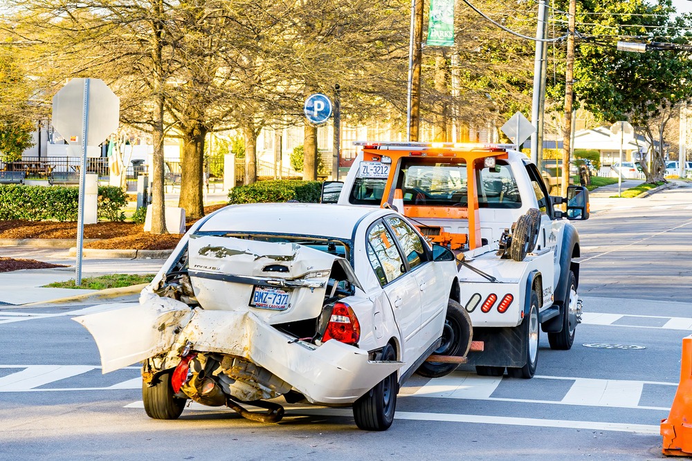car being hauled away by a tow truck