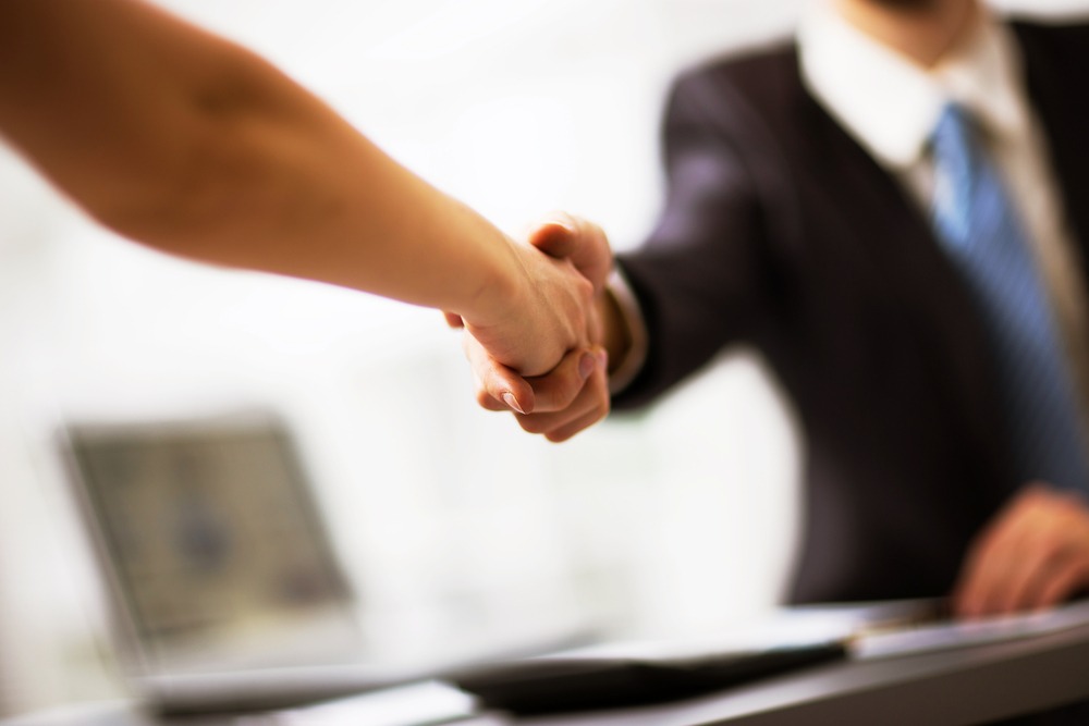 client shaking hands with a lawyer