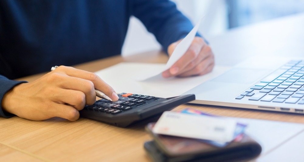 man calculating his finances
