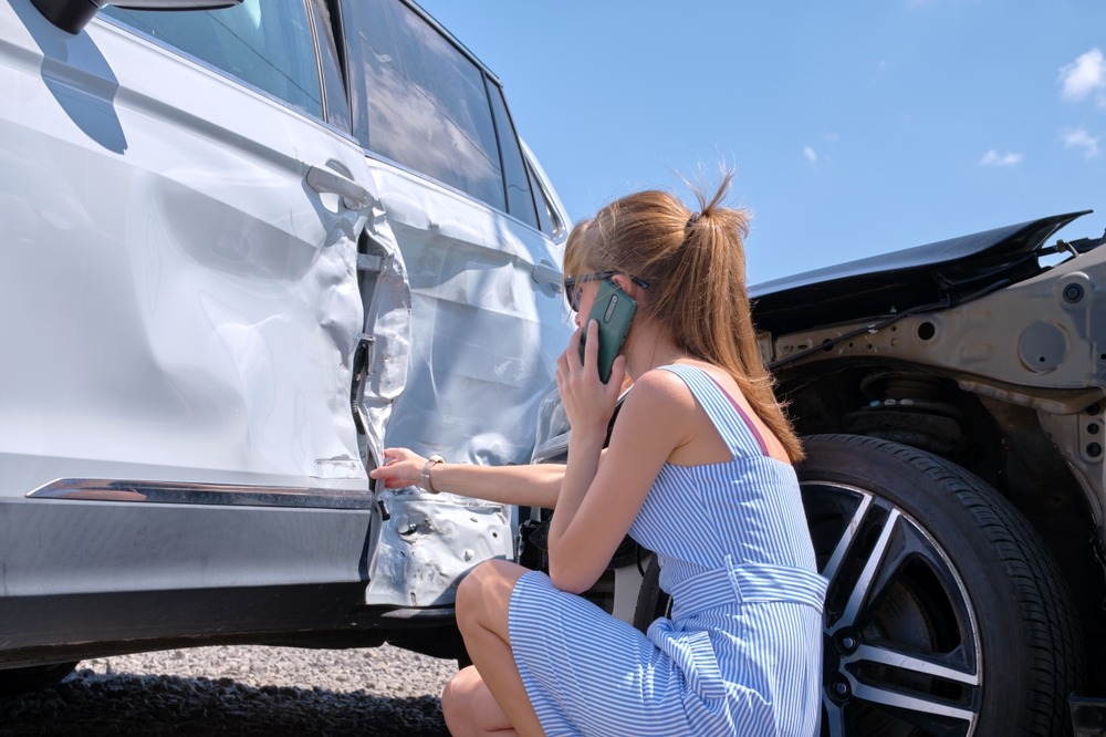 A woman on the phone after a car accident. Can you sue someone for a car accident in sc?